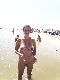 Preggo nudist at the beach.