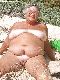 Naked granny on the beach