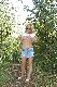 Blonde mature exposing boobs during walk in the nature